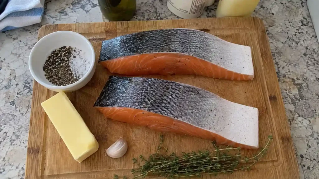 raw salmon fillets and ingredients for pan-searing